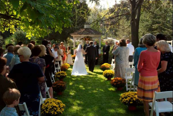 The wedding photographer captures the wedding processional.