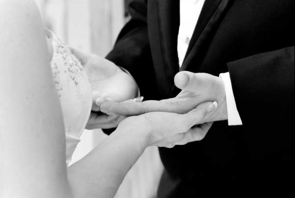 Holding hands during the wedding ceremony.