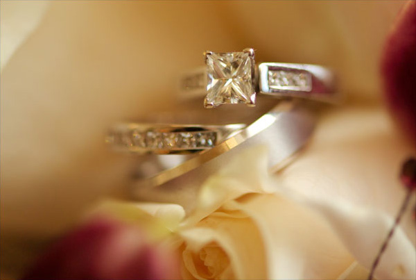 The wedding photographer creates a still life of the wedding rings.