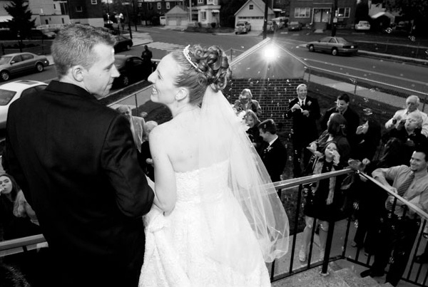 The bride and groom leave for the reception.