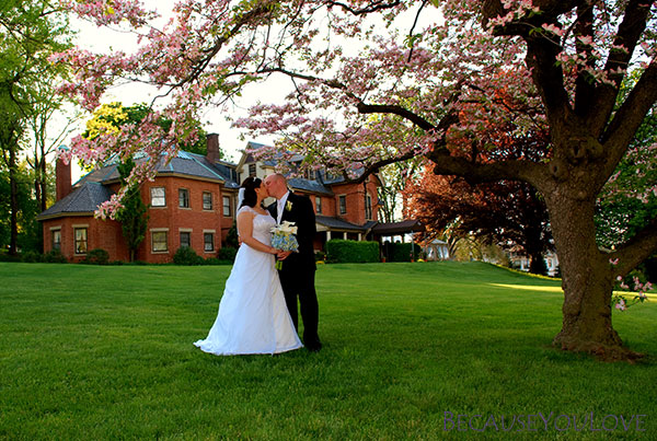 A romantic bride and groom in front of the Sayre Mansion in Pennsylvania