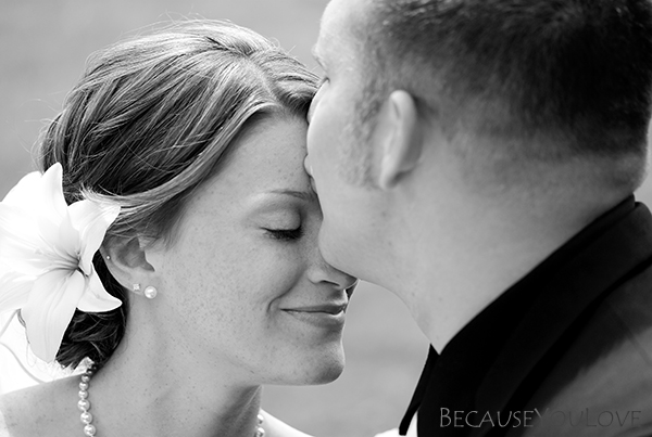 The bride and groom share a quiet moment in this journalistic photograph