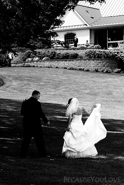 The wedding photographer captures a journalistic image of the bride and groom