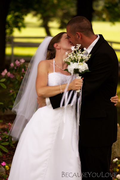 A kiss between the bride and groom