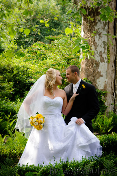 bride and groom pose romantically