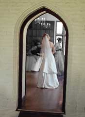 artisitc photograph of bride in doorway