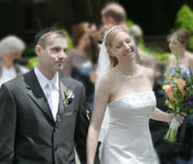 journalistic photograph of bride and groom returning after the wedding ceremony