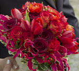wedding photographer captures the vivid red color of these wedding flowers