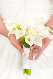In this photograph the wedding photographer pennsylvania photographs the flowers for the bride after the wedding ceremony