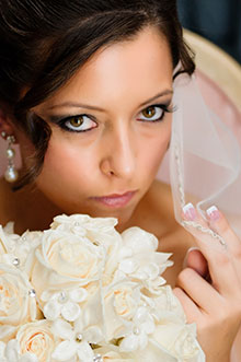 In this photograph the wedding photographer pennsylvania photographs the bride and her flowers