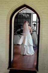 artisitc photograph of bride in doorway