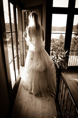 artisitc photograph of bride in doorway
