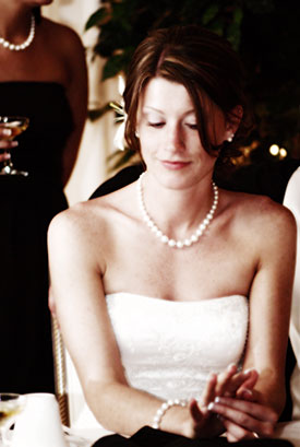 this wedding photograph of the bride admiring her ring has been artistically enhanced