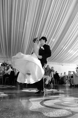 journalistic photograph of the bride and groom having their first dance