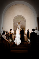 journalistic photograph of bride and groom during the wedding ceremony