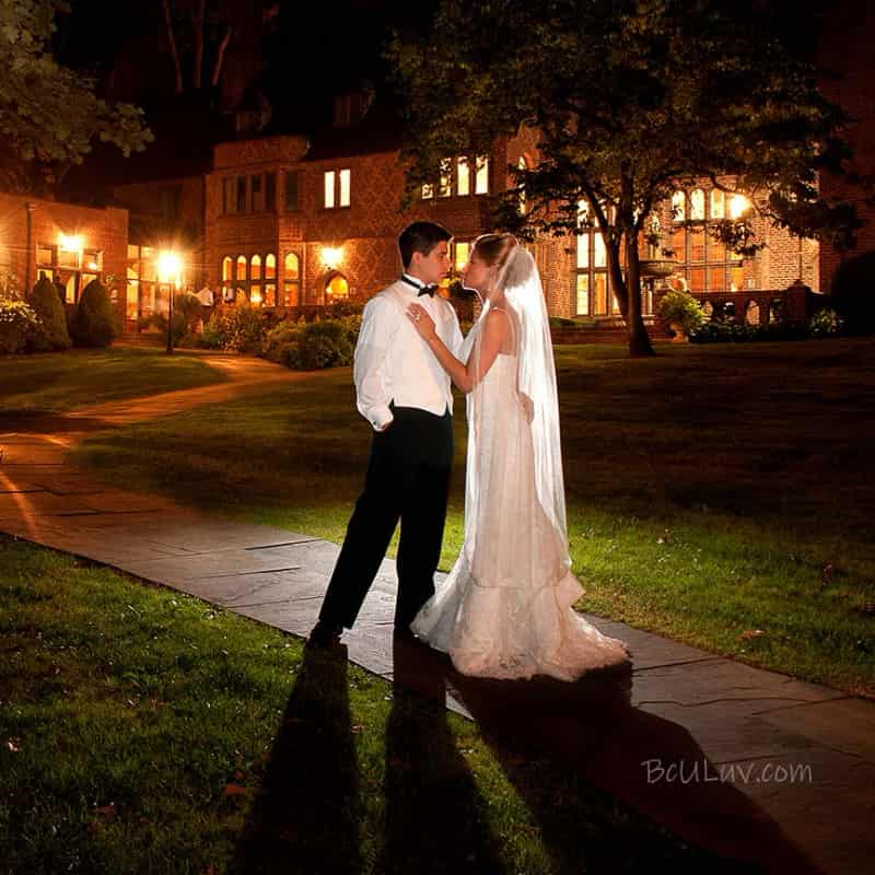 bride and groom behind a reception venue