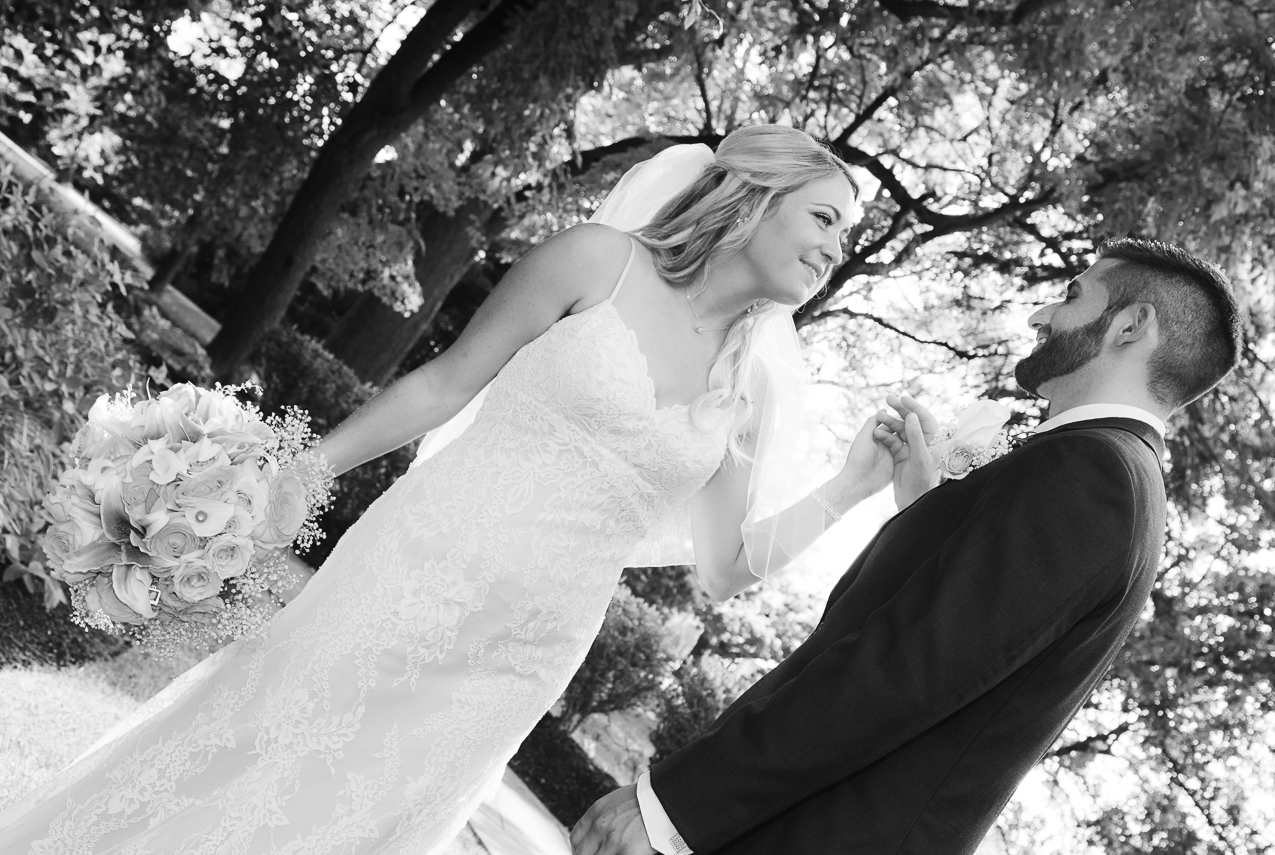 photograph of bride and groom holding hands after their ceremony