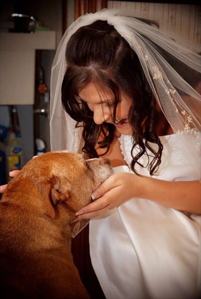 The bride says goodbye to her dog friend